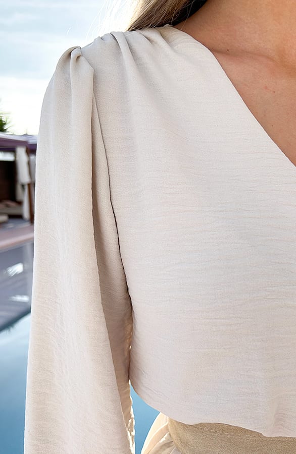 V-hals Knopen Jurk Emmy Beige – shoparchief — foto 5